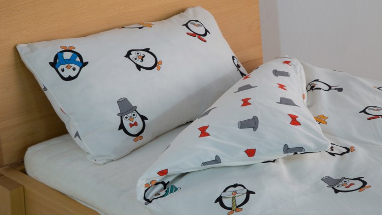 Omkeerbaar bedlinnen - een samenspel van coole pinguïns en grappige hoedjes